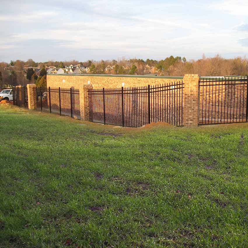 iron-brick-development-fence Decorative brick and iron fence around development