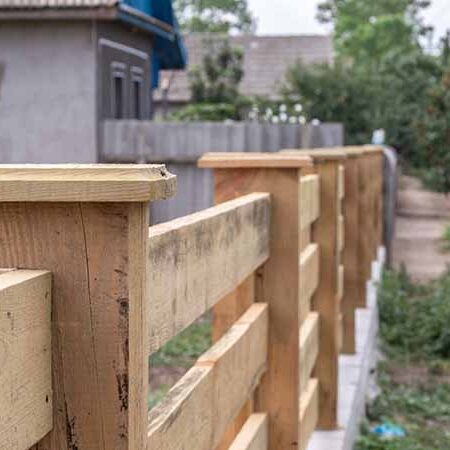 insert-new-wooden-fence Slat style wooden fence