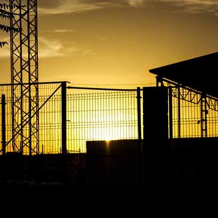 silhouette-secure-center Secure center with silhouette of fence